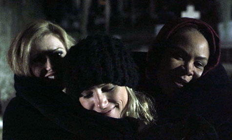 Johanna, Ashley and Joy keep warm